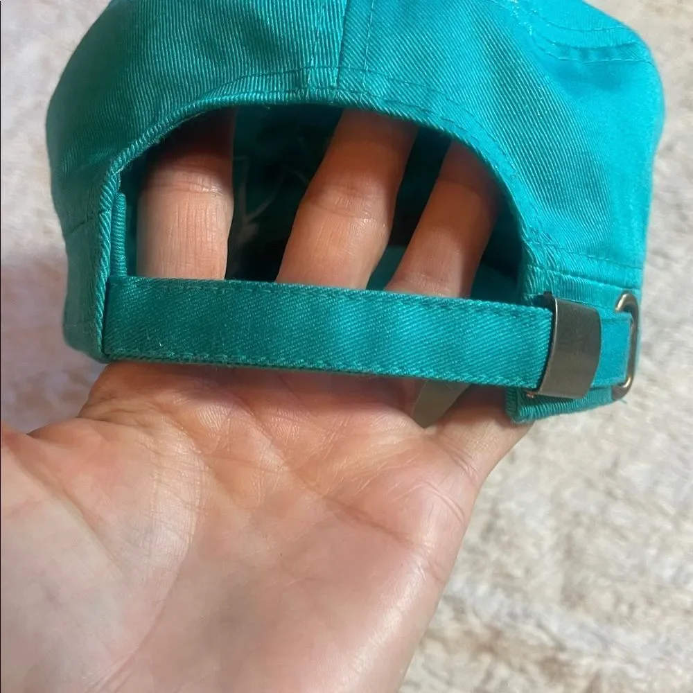 Teal Cap with Green Cross Design